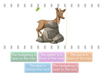 Where's the deer? On/In front of/behind/next to